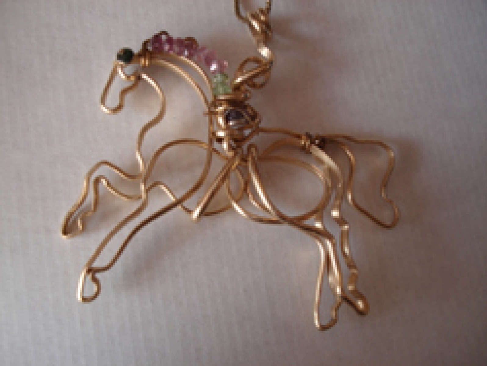 Tourmaline horse pendant.